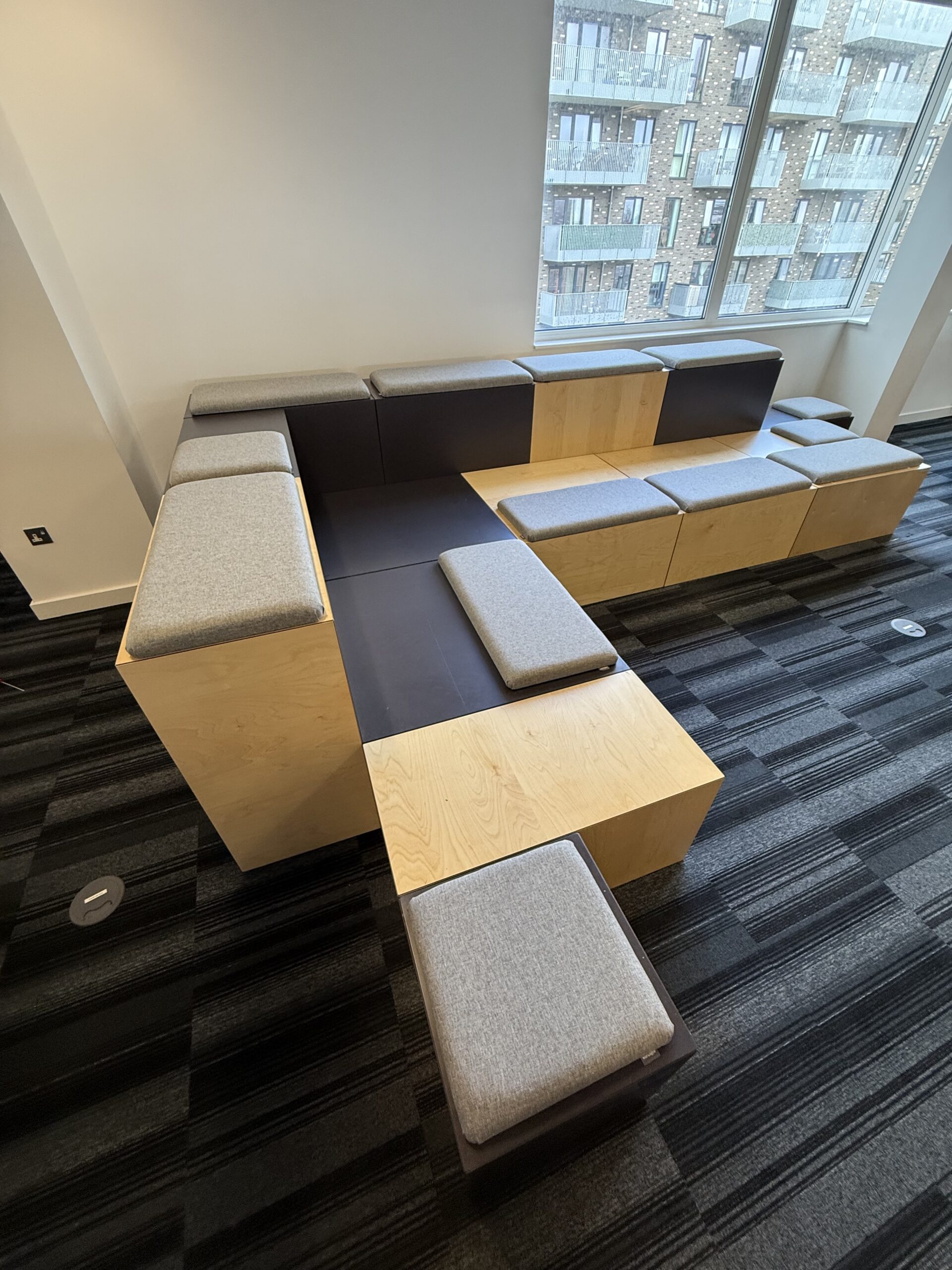 used box seating with soft cushioned seating pads by Agile